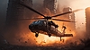 Helicóptero escapando de la explosión en la ciudad con fuego | Foto de stock