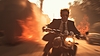 Action shot with man riding away on bike. Dynamic | Stock Foto