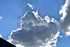 Dramatic Cloudscape with Sunlight Streaming Through | Stock Foto